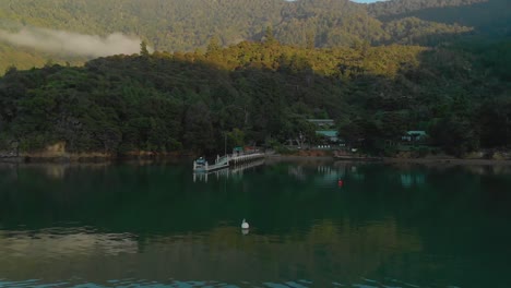 morning aerial flying over sea towards bay in marlborough sounds, new zealand, cinematic shot