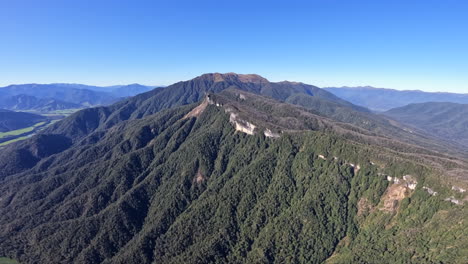 aerial pov shot from a helicopter flying over the start of the southern alps, new zealand