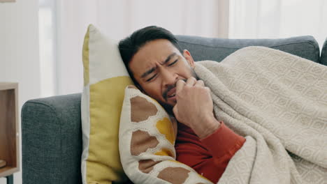 sick, tired and sad man lying on sofa at home