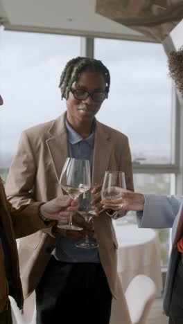 friends toasting with wine in a restaurant