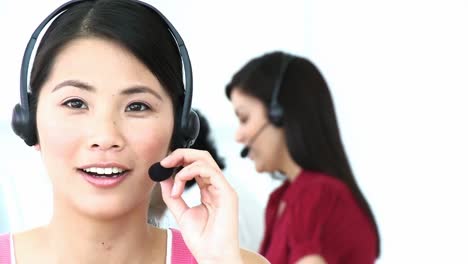 Close-up-of-Asian-woman-working-in-a-call-center