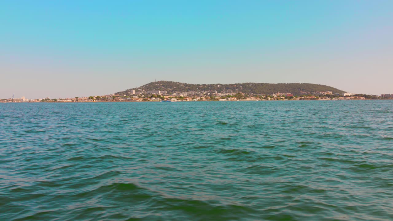 Peaceful view of Etang de Thau, Sète under clear blue sky