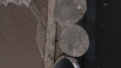 Walking-through-the-breakwater-by-the-Baltic-Sea-in-slow-motion