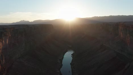 aerial view of colorado river flowing through marble canyon in arizona during sunset