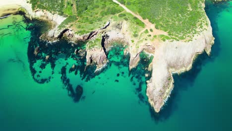 top view of ponta da piedade limestone rock cape in lagos, portugal. aerial shot