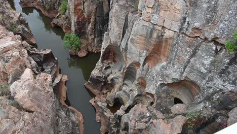 slow moving panorama of a canyon at bourke's luck geological wonder, south africa