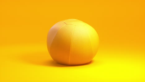 Dynamic-3D-Animation:-Yellow-medicine-ball-rotates-against-a-clean-golden-yellow-backdrop