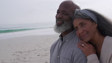 Mature-couple-enjoying-time-outside-by-the-sea