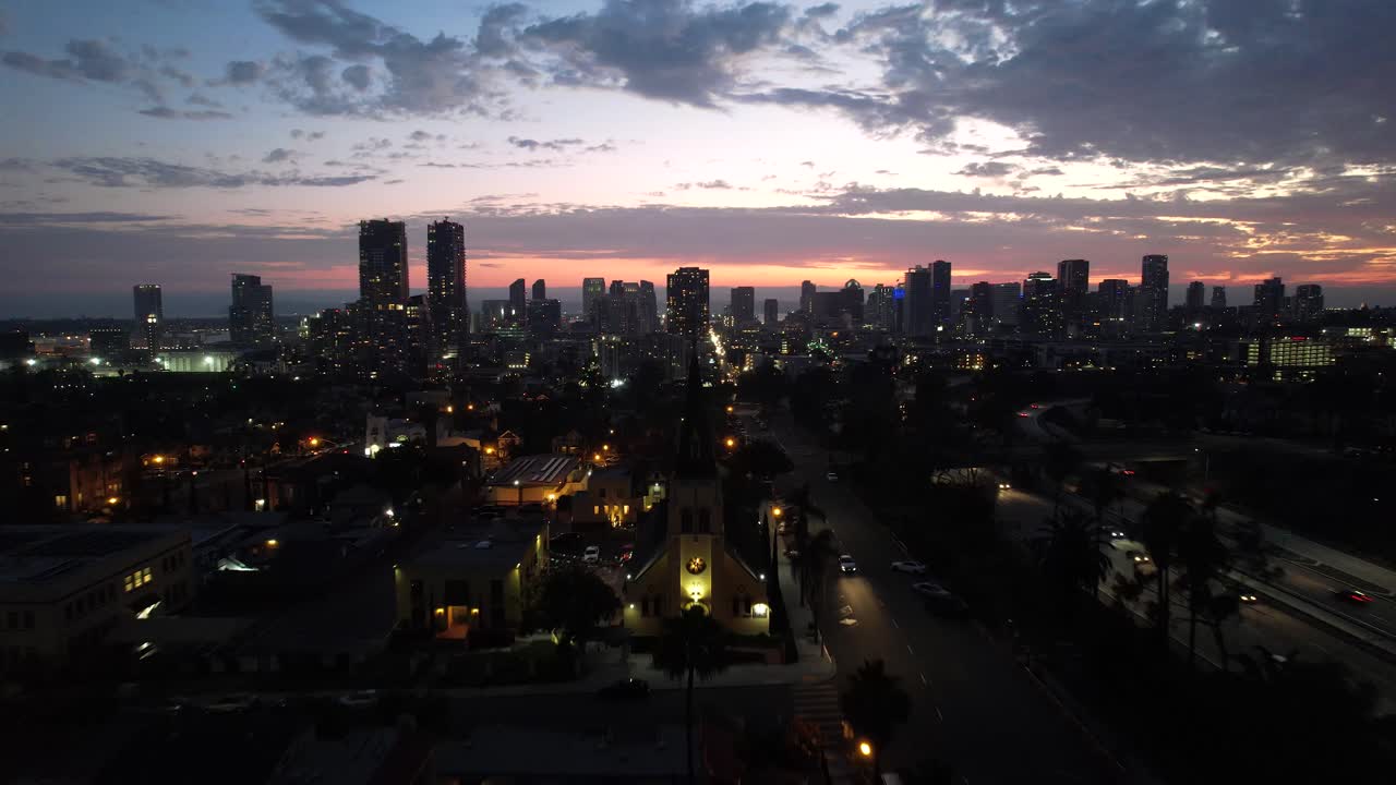 San Diego Sky line at Sunset June 2 2021 orange and red sky 4k Mavic air 2S Palm trees. Sunset was at 8:01pm and this clip was filming shortly after.
