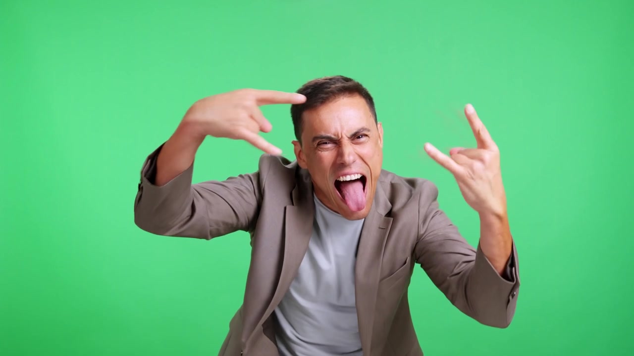 Expressive man making funny faces on green screen