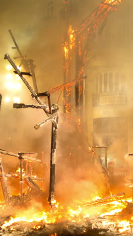 valencia, spain - 31 march 2024 : the final night of las fallas in valencia where the paper mache statues are burned in vertical