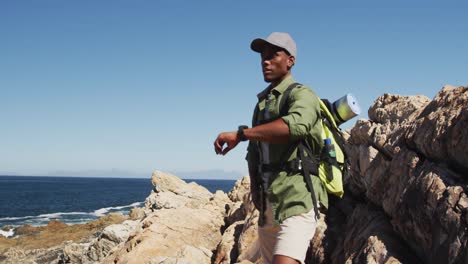 African-american-man-hiking-in-countryside-by-the-coast