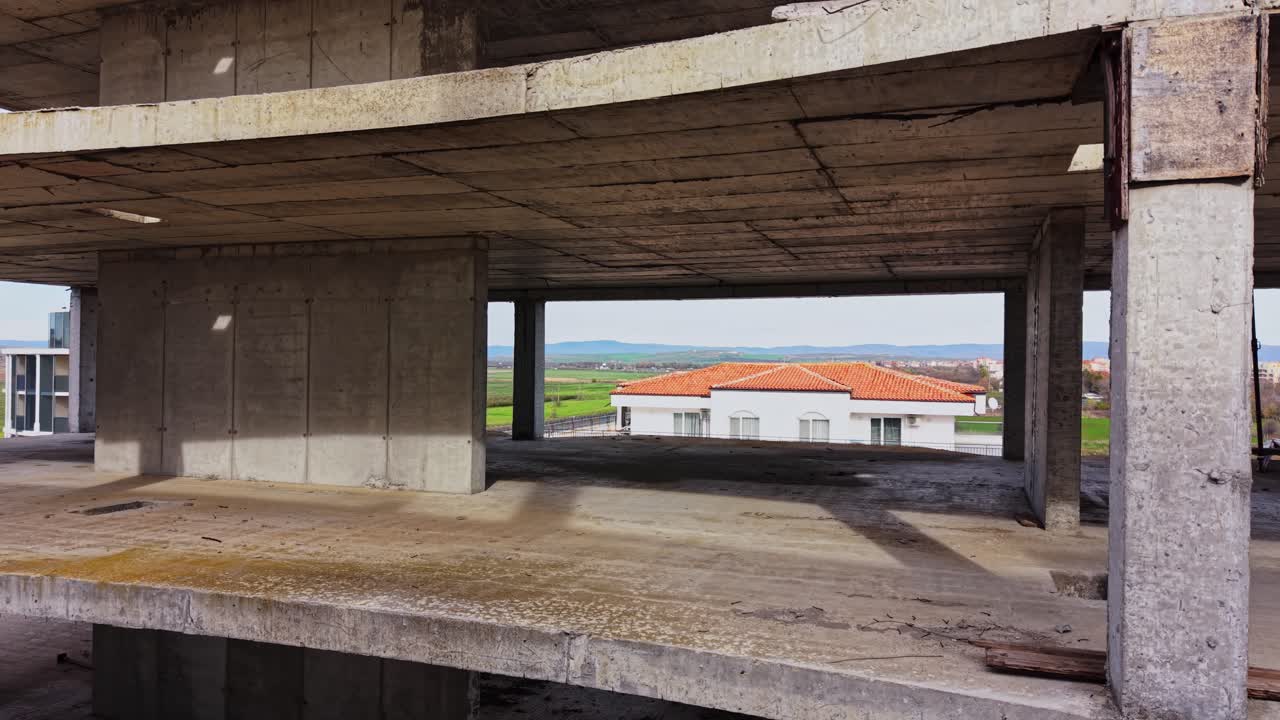 Empty concrete structure with rural landscape in the background
