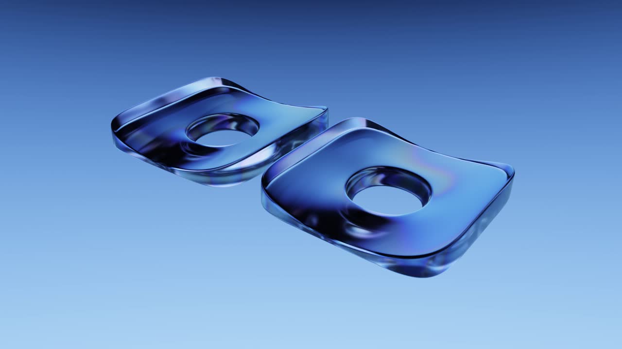 Two Abstract Iridescent Glass Shapes Rotating in Blue Space