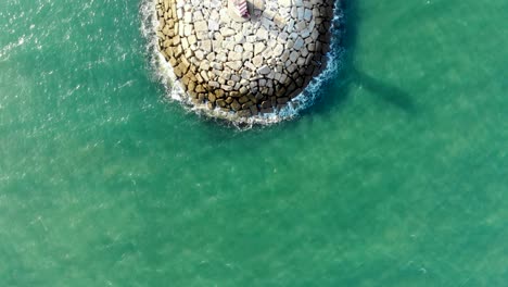 Ocean-and-Pontoon-with-a-Lighthouse-in-a-Sunny-Day