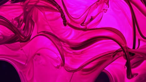 abstract swirling pink and purple fluid background