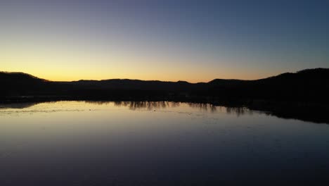 sunrise/sunset over a tranquil river valley