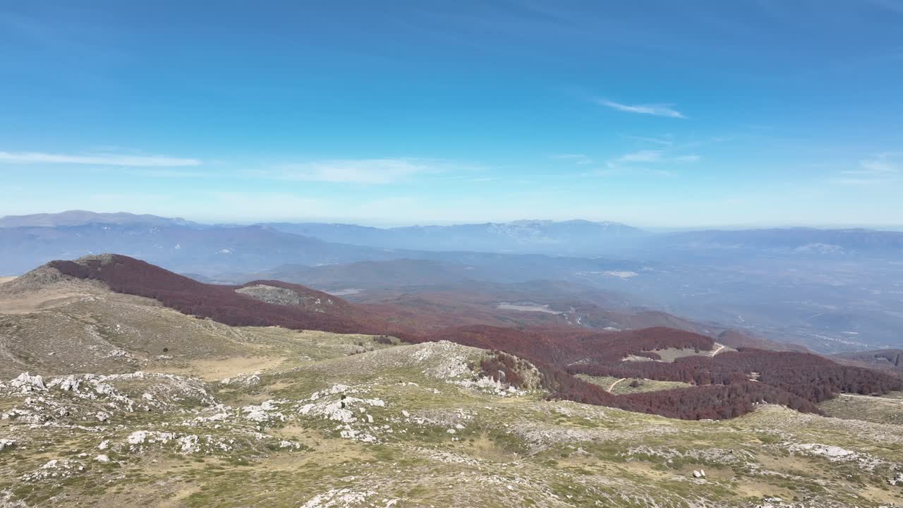 Drone paralax shot on top of Vermio summit, panoramic view of Greece autumnal landscape