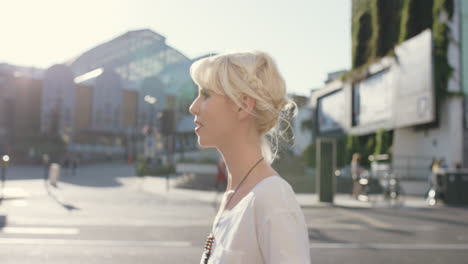 Beautiful-blonde-walking-through-city