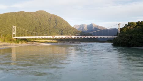 karangarua suspension bridge at sunset