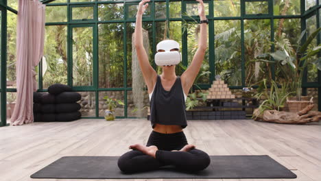 practicing yoga, woman wearing vr headset and sitting cross-legged on yoga mat