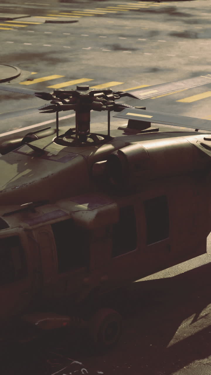 Military helicopter landing in urban environment during twilight