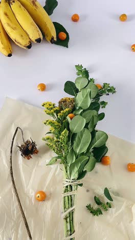 arrangement of bananas, flowers, and berries