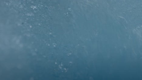 water falling through the ice in the perito moreno glacier, the most iconic glacier in the world