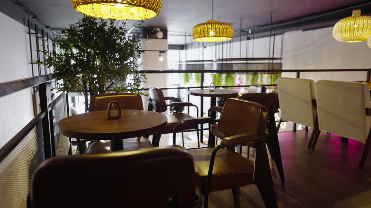 Modern Cafe Interior with Brown Leather Chairs and Wooden Tables