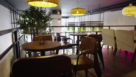 modern cafe interior with brown leather chairs and wooden tables
