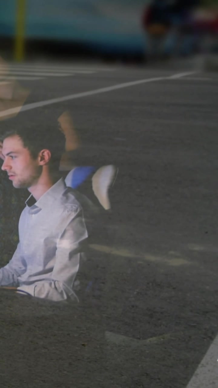 Business worker lowering gaze after hand appears reaching to get as overlay showing crowd crossing