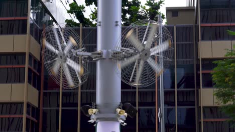 outdoors fans on against office building, singapore