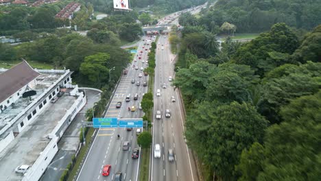 Droneshot-above-the-highway,-showing-traffic-in-Kuala-Lumpur,-Malaysia