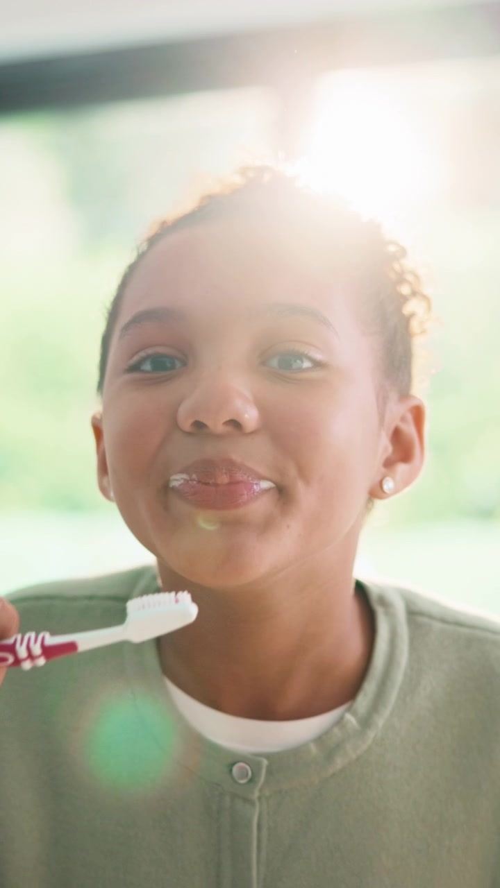 Young Girl Brushing Her Teeth in the Morning