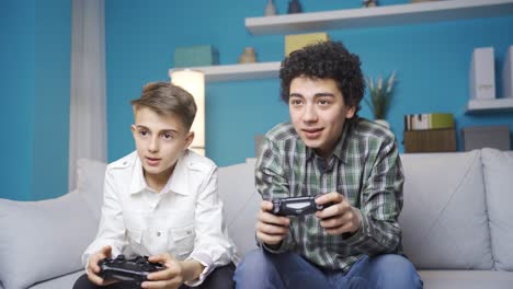 brothers playing video game.