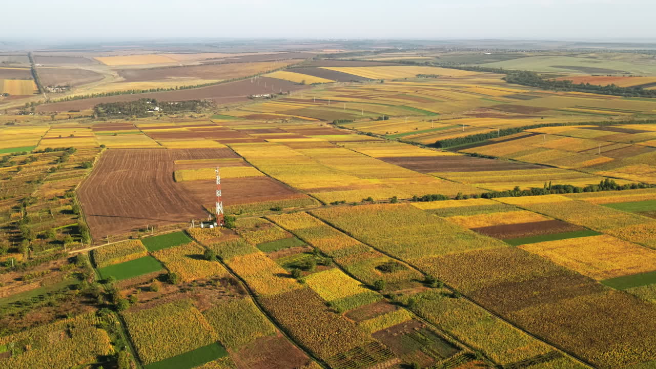 Aerial drone view of nature in Moldova at sunset. Wide fields, hills and roads