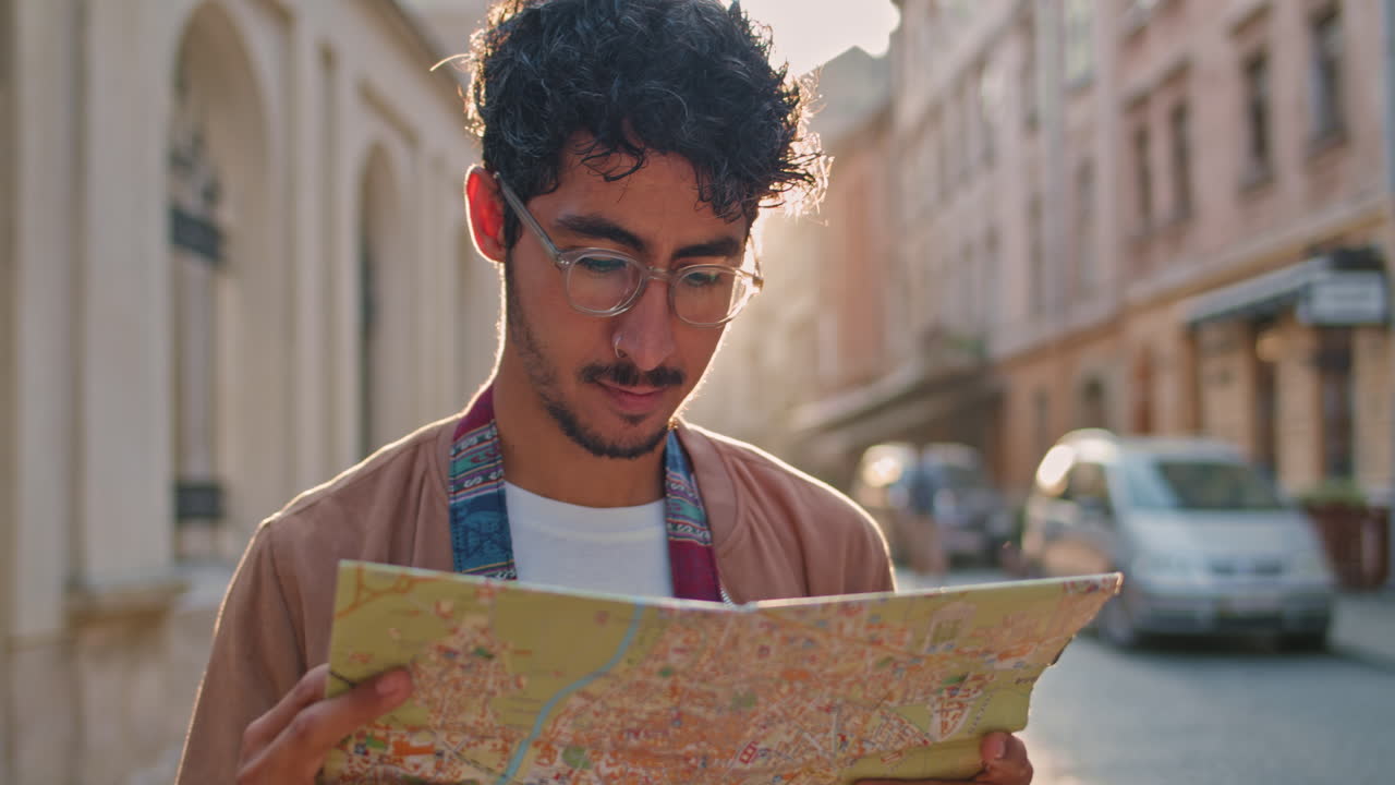 Man with a map exploring a city