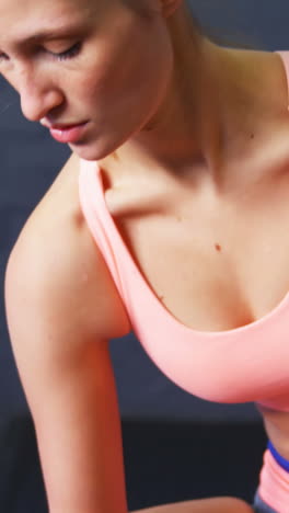 woman exercising with dumbbell