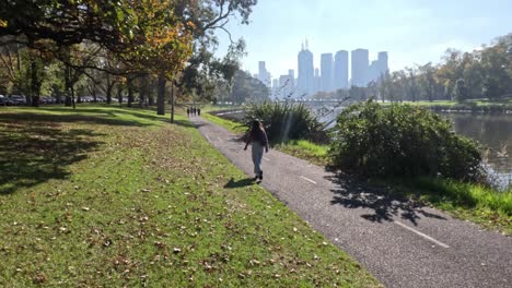 people walking and cycling near yarra river