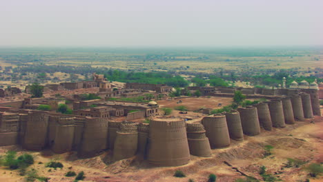 aerial flight over the the historically-significant derawar fort, enormous and impressive structure in the heart of the cholistan desert, located south of the city of bahawalpur, pakistan