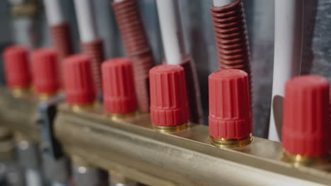 slider shot: heating system comb - many plastic pipes go into the floor to heat the room.