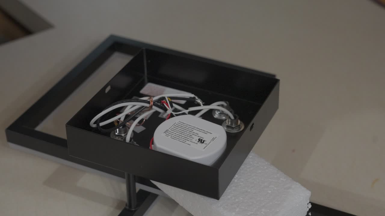 Showing the back of the new fixture out of the box