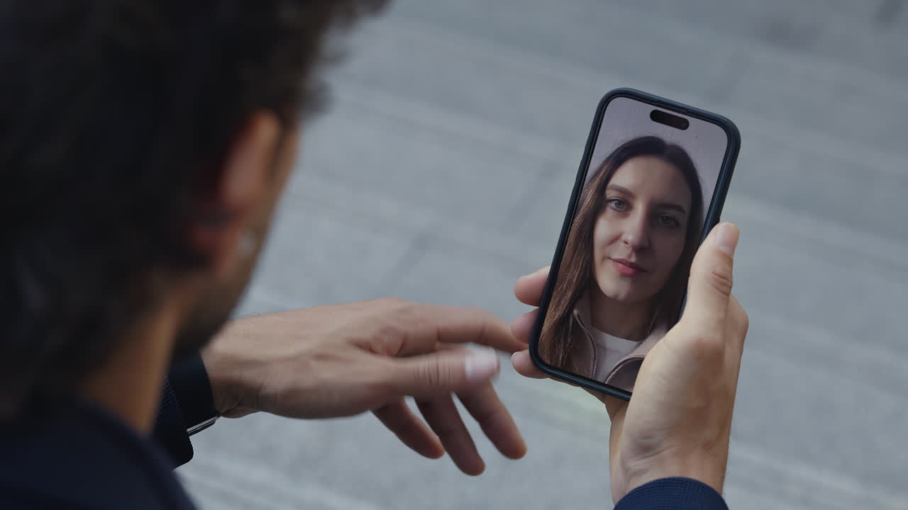 Man Talking to Woman on Video Call via Smartphone