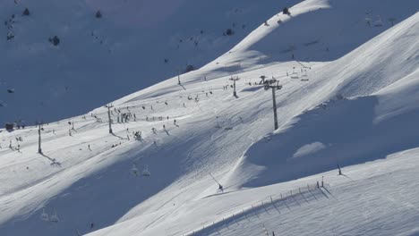 slow motion of the ski resort pas de la casa, with skiers and lifts