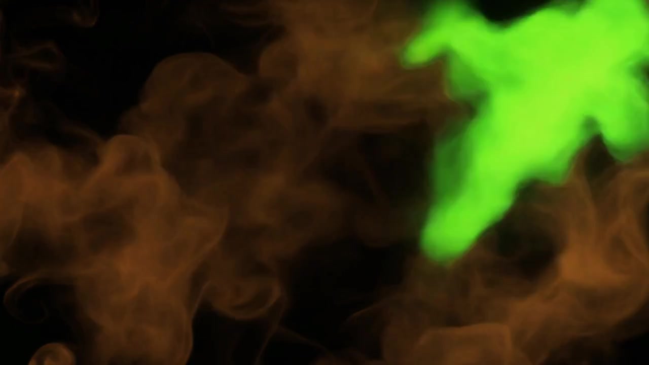 Fumo astratto verde e arancione vorticoso su sfondo nero