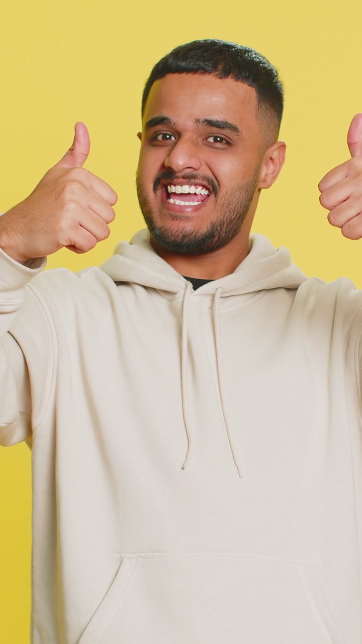 Excited indian young winner man feeling very proud pointing hisself overjoyed by success victory