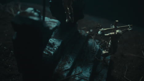 miniature mummified dolls hanging on the gallows at night