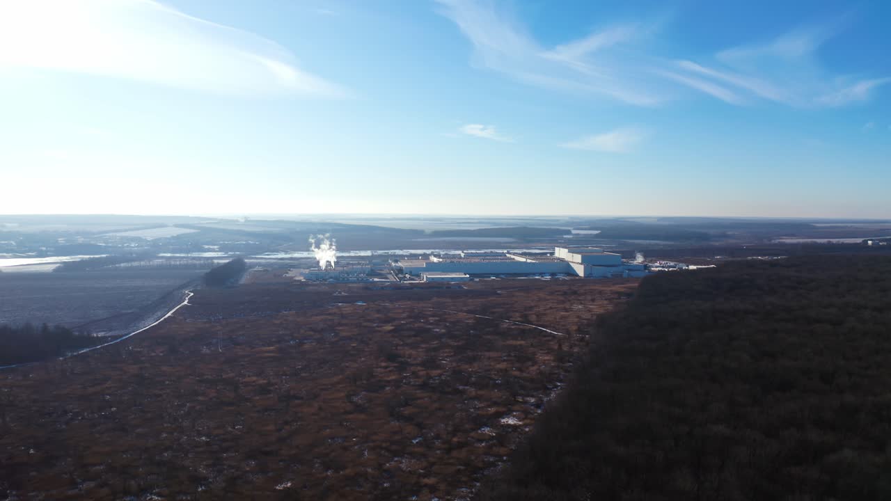 Flying over industrial area. Aerial drone view of industry in forest nature