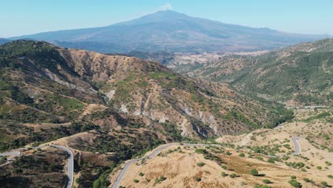 Sicily-Scenic-Road-and-Mount-Etna-Volcano-View-in-Sicily,-Italy---Aerial-4k