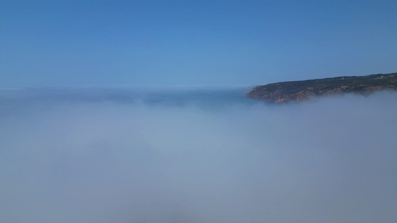 Flying over the fog, with the Guincho sea coast and the natural park as a backdrop,Cascais,Portugal